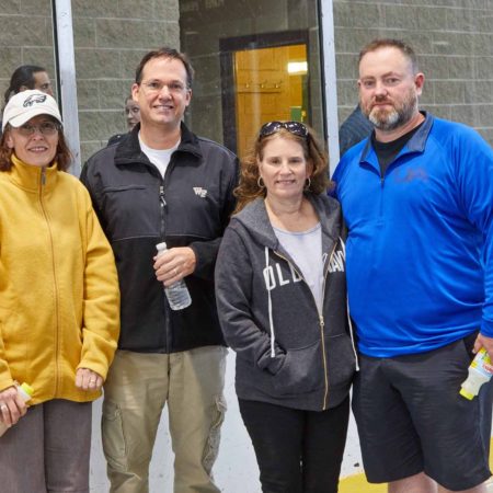 a group of people standing in front of a building