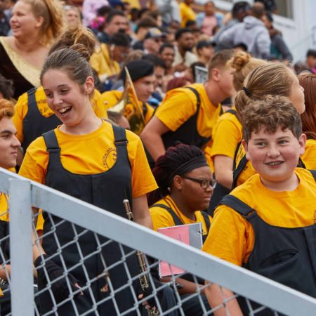 a group of people in yellow shirts
