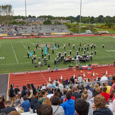 a group of people on a football field