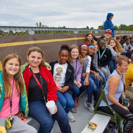 a group of people sitting on a bench