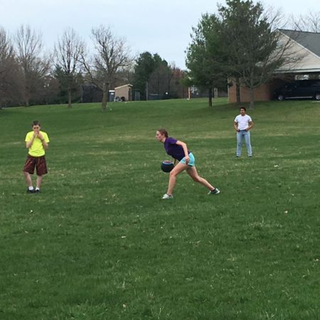a group of people playing with a ball
