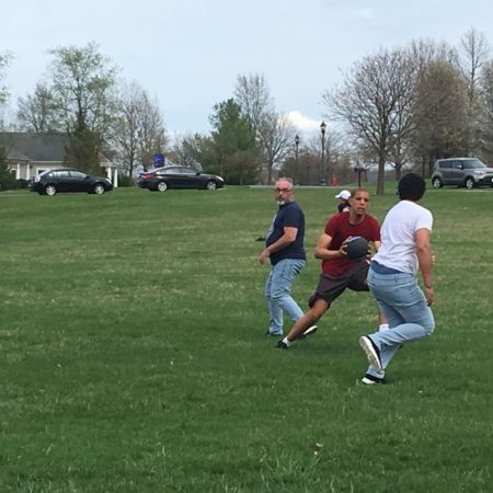 a group of people playing with a ball