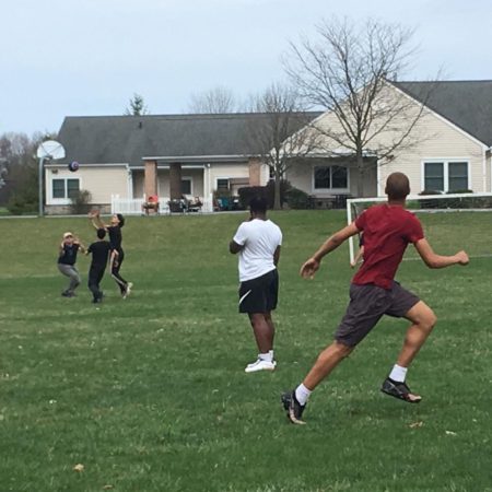 a group of people playing football