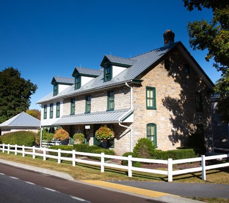 a house with a white fence