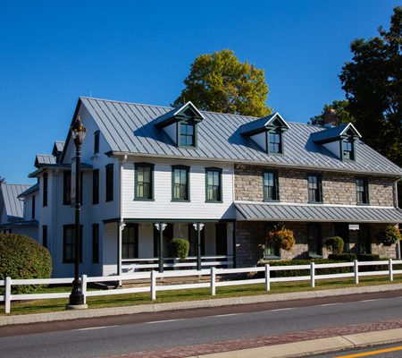 a white house with a white fence