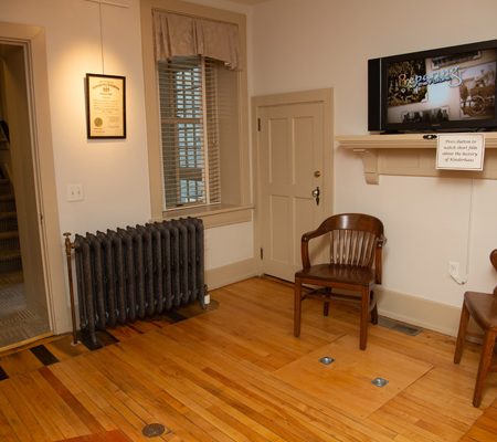 a room with a chair and a radiator