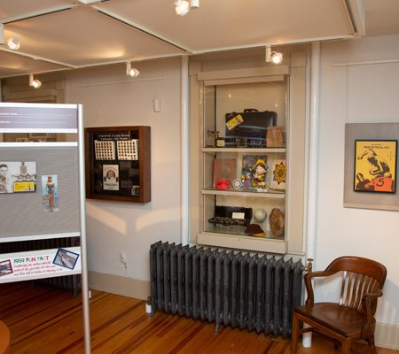 a room with a radiator and a shelf