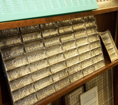 a shelf with silver trays