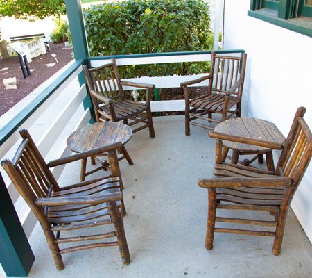 a group of chairs on a porch