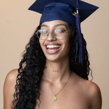 a person wearing a graduation cap and glasses