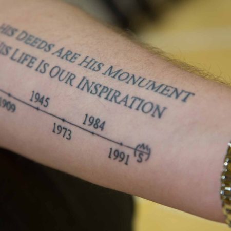 a person's arm with a tattoo