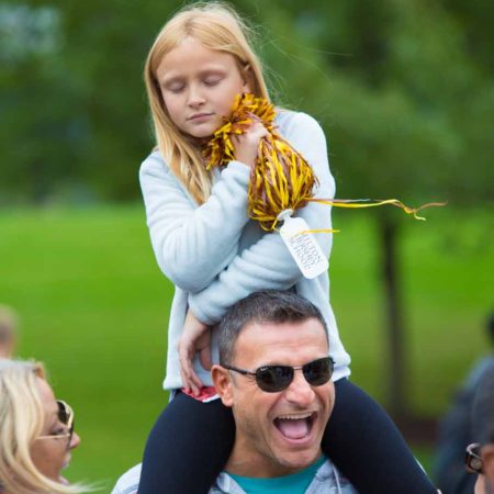 a child on a person's shoulders