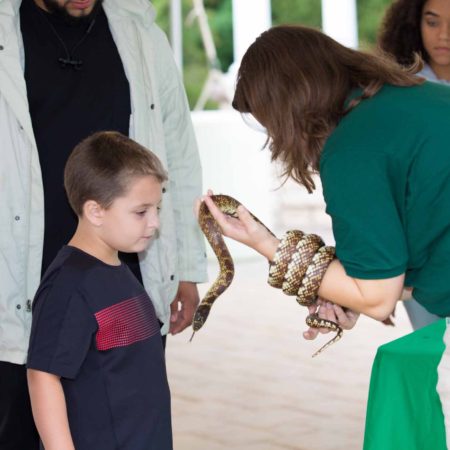 a person holding a snake