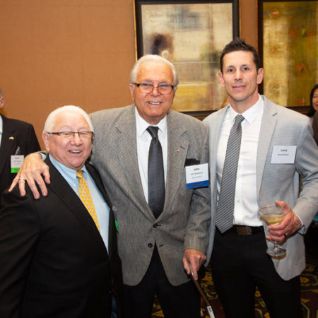 a group of men posing for a photo