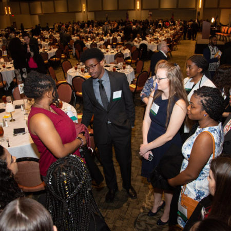 a group of people standing in a room