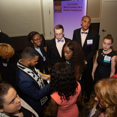 a group of people standing in a room