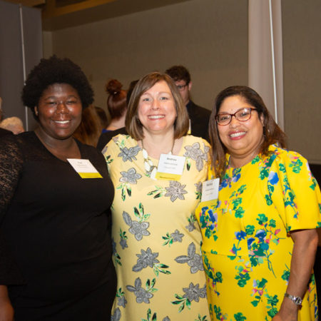 a group of women smiling at camera