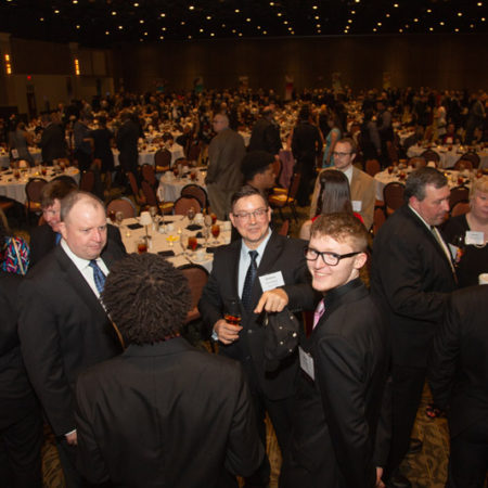 a group of people in suits