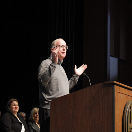 a person standing at a podium