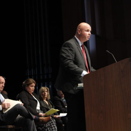 a person standing at a podium