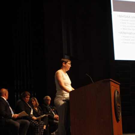 a person standing at a podium