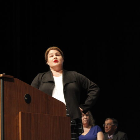 a person standing at a podium
