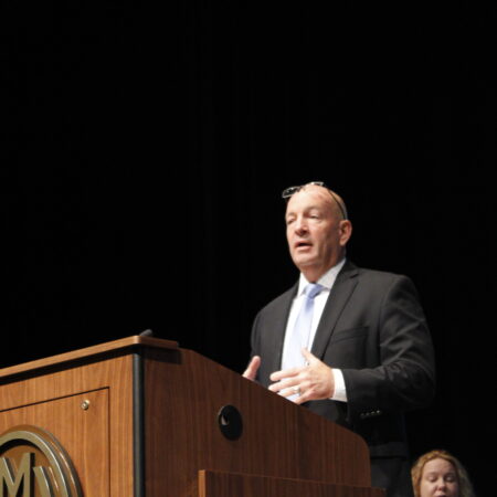 a person standing at a podium