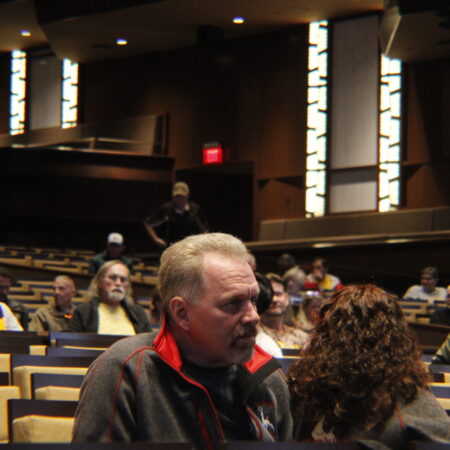 a person sitting in a lecture hall