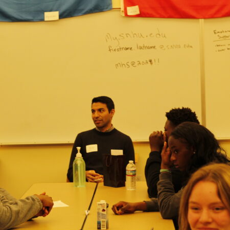 a group of people sitting at a table