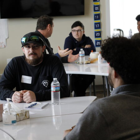 a group of people sitting at tables