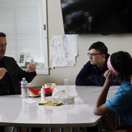 a group of people sitting at a table