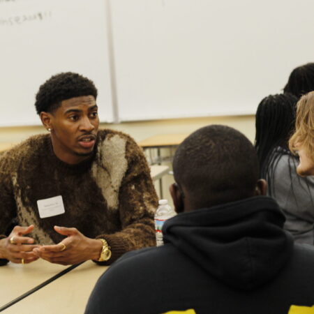 a person talking to a group of people