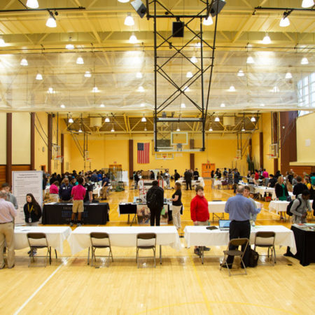 a group of people in a large hall