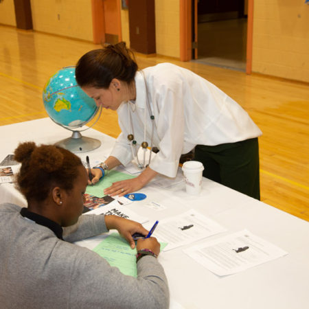 a person writing on a paper