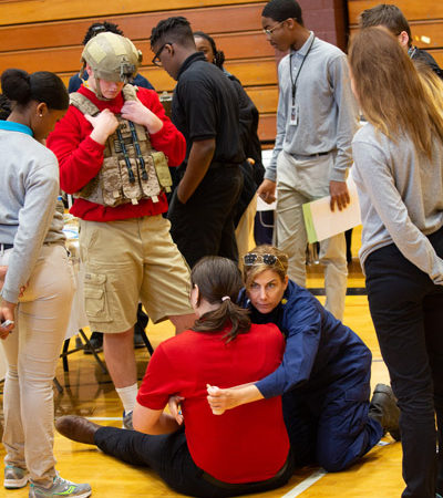 a group of people around each other