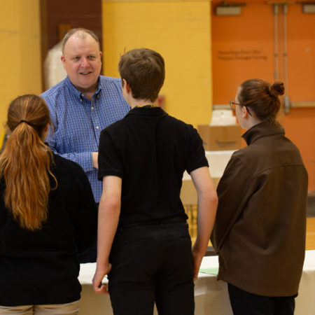 a group of people standing in a room