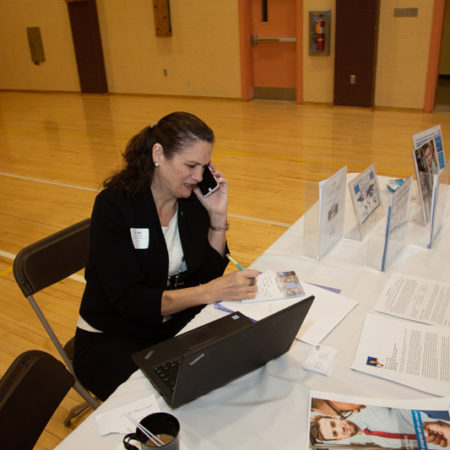 a person on the phone at a table