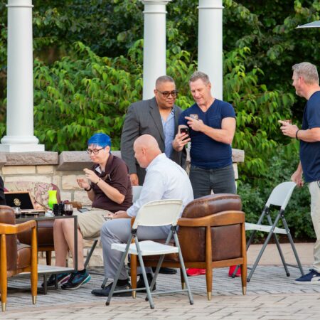 a group of people sitting outside