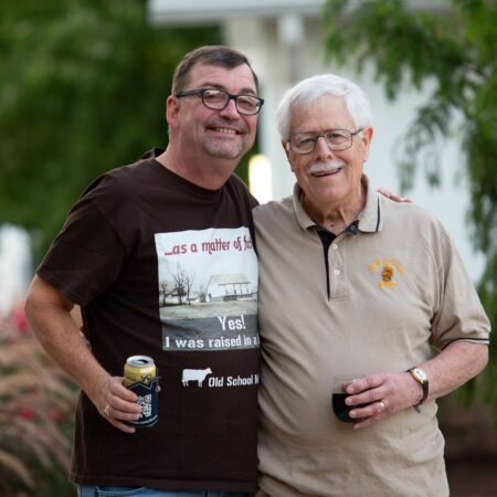 a couple of men standing together
