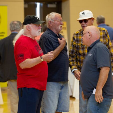 a group of men standing in a room