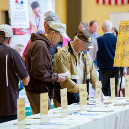 a group of men at a table with signs