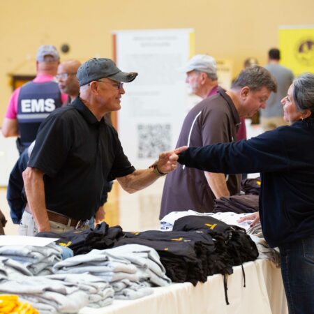 people at a table with clothes
