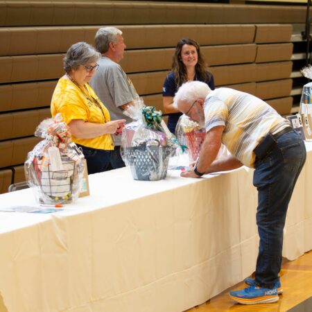 a group of people standing at a table