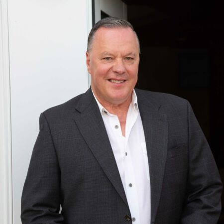 a person in a suit smiling