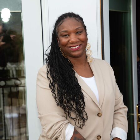 a person in a beige jacket