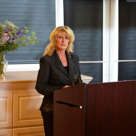 a person standing at a podium