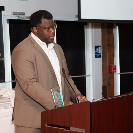 a person standing at a podium
