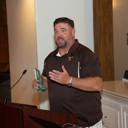 a person standing at a podium