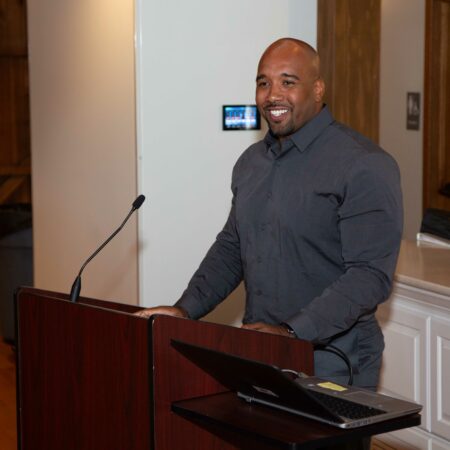 a person standing at a podium
