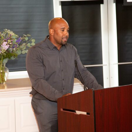 a person standing at a podium